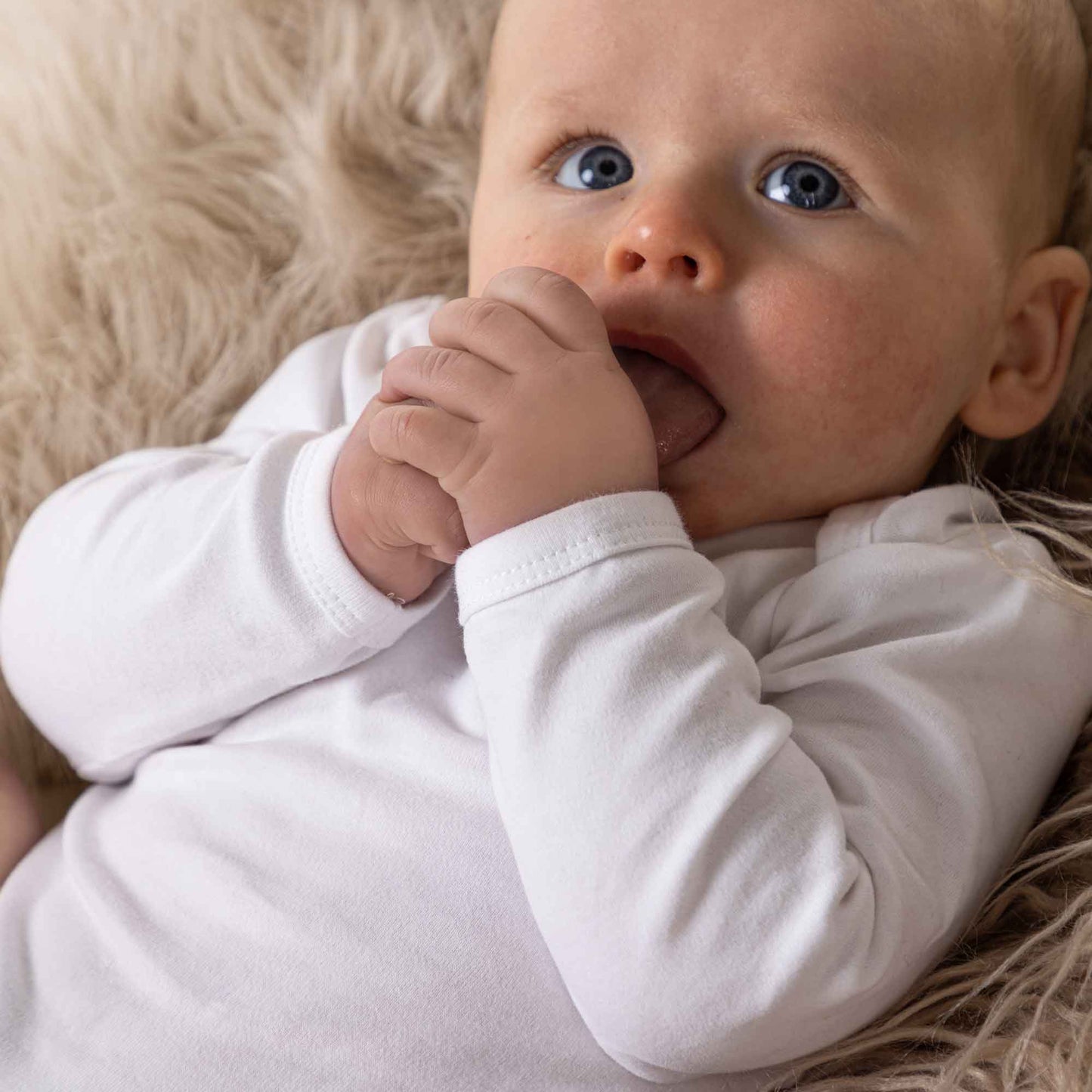 Longsleeve white baby bodysuit vest